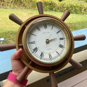 Vintage ship’s wheel brass clock