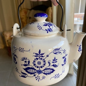 Vintage white and blue light ceramic kettle
