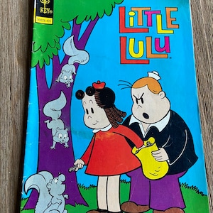 May include: A vintage comic book cover featuring Little Lulu, a young girl with red hair and a red dress, standing next to a man with a sailor hat and a yellow bag. The comic book is titled "Little Lulu" and is priced at 20 cents. The cover is blue with a purple tree and three gray squirrels.