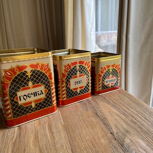 Vintage orange and black tins
