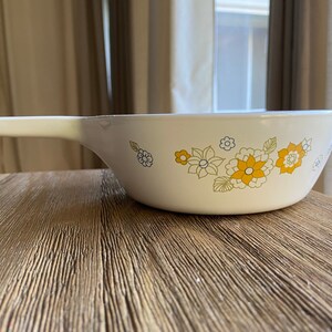Vintage Corning small casserole dish with yellow flowers