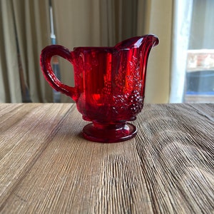 Vintage red glass creamer