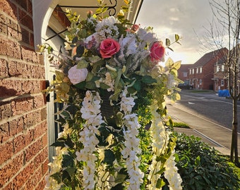 Artificial pink, white and ivory hanging basket