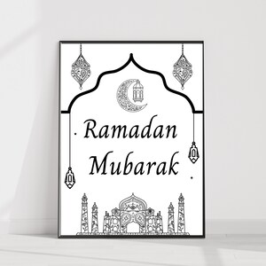 May include: Black and white printable art print with an Islamic design featuring a crescent moon, lanterns, and a mosque. The text "Ramadan Mubarak" is written in a decorative font.