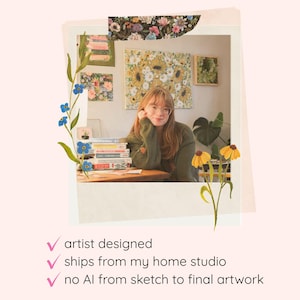 May include: A polaroid-style frame containing a person in a green sweater sitting at a desk with a stack of books, surrounded by floral illustrations. Below the frame, text reads: artist designed, ships from my home studio, no AI from sketch to final artwork.
