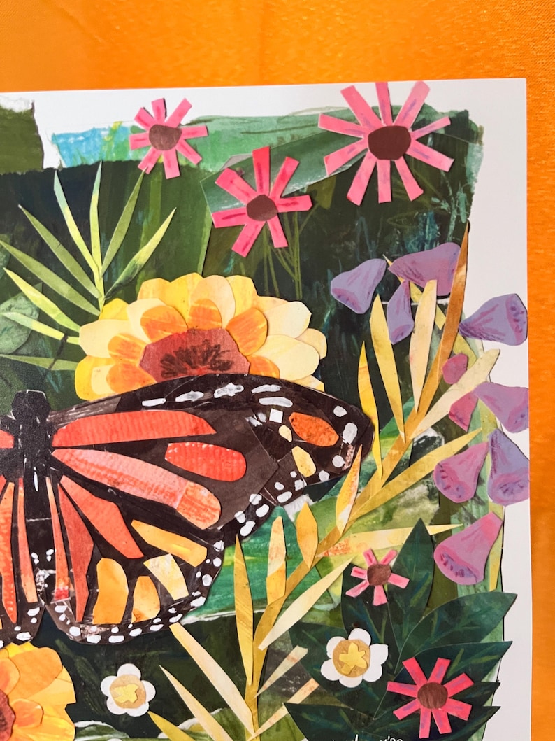 May include: A paper collage artwork featuring a large monarch butterfly with orange, black, and white wings positioned among various cut-out paper flowers in shades of pink, yellow, and purple, set against a layered green foliage background.