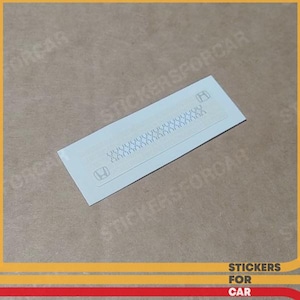 May include: A white rectangular sticker featuring the Honda logo and a repeating pattern of small shapes. The sticker has rounded corners. The text "STICKERSFORCAR" is visible in the bottom right corner.