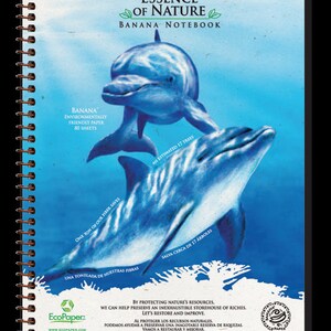 May include: A spiral-bound notebook with a blue dolphin illustration. The cover reads "Essence of Nature Banana Notebook" and includes text about environmentally friendly paper and saving trees. The notebook contains 80 sheets.