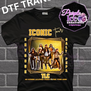 May include: Black t-shirt featuring a graphic of the Iconic Tour with the groups En Vogue, Salt-N-Pepa, and TLC. The design includes gold lettering and a purple logo. The text "NO SCRUBS ALLOWED-PUSH IT&FREE YOUR MIND" is also visible.