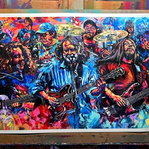 May include: A vibrant, colorful painting of a band performing on stage. The artwork features multiple musicians playing guitars, drums, and singing into microphones. The style is impressionistic, with bold brushstrokes and a rich palette of blues, reds, and yellows.