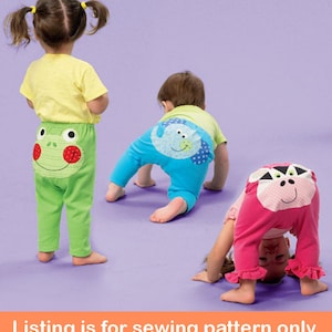 May include: Sewing pattern for children's pants with animal designs on the back. The pants are green, blue, and pink. The animals are a frog, an elephant, and a pig.
