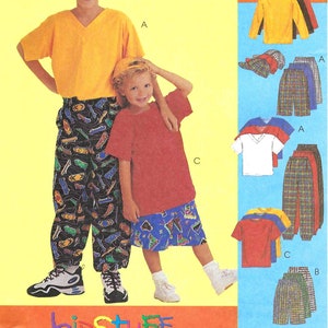 May include: Sewing pattern for kids clothing. The pattern includes instructions for making a yellow short-sleeved shirt, a red short-sleeved shirt, a pair of plaid pants, and a patterned skirt.