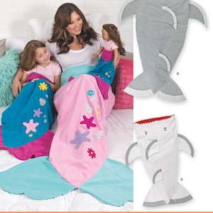 May include: Sewing pattern for a shark and mermaid tail blanket. The pattern includes instructions for making a grey shark tail blanket and a pink mermaid tail blanket with colourful embellishments. The listing is for the sewing pattern only.