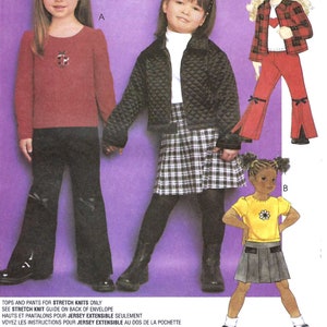 May include: Sewing pattern for children's clothing. The pattern includes three different outfits: a red top with black pants, a black quilted jacket with a plaid skirt, and a yellow top with a gray skirt. The pattern is for stretch knit fabrics only.