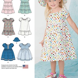 May include: A sewing pattern for a girl's dress with a variety of fabric options, including floral, polka dot, gingham, and denim. The pattern includes a matching hat.
