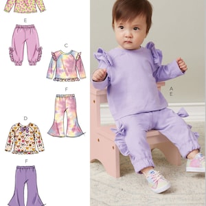 May include: A sewing pattern for a baby outfit with a ruffled top and trousers. The pattern includes a variety of options for the top and trousers, including a solid colour, a floral print, and a tie-dye print. The pattern is for sizes 0-3 months.