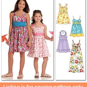 May include: Sewing pattern for girls' dresses. The pattern includes four different styles: a halter dress, a sleeveless dress, a dress with a ruffle trim, and a maxi dress. The dresses are all in floral prints.