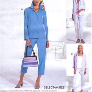May include: A sewing pattern for a women's suit with two different styles. The first style is a light blue suit with a collared shirt and pants. The second style is a white suit with a white jacket and pants. The pattern is called "Select-A-Size" and is from the "Woman's Day Collection".