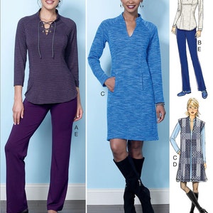 May include: Sewing pattern for three different tops. The first top is a purple and grey striped long-sleeved top with a lace-up neckline. The second top is a blue long-sleeved tunic with a V-neckline. The third top is a white long-sleeved shirt with a high neckline. The pattern includes instructions for making all three tops.