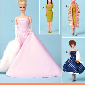 May include: A sewing pattern for making doll clothes. The pattern includes three different outfits: a pink gown, a green dress, and a blue polka dot dress with a white jacket.