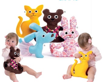 May include: McCall's Crafts sewing pattern for making plush toys. The pattern includes instructions for making a cat, a bear, a bunny, and a dog. The toys are all made from fabric and have embroidered features.
