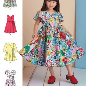 May include: Sewing pattern for a girls' wrap dress with short sleeves. The pattern includes four different variations: a floral print, a solid red, a solid yellow, and a checkered print. The pattern is for sizes 2-12.