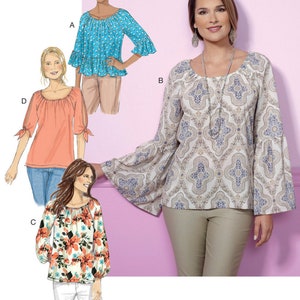 May include: A sewing pattern for a women's blouse with four different variations. The pattern includes a scoop neck, 3/4 sleeves, and a gathered detail at the neckline. The blouse is shown in four different fabrics: a floral print, a paisley print, a solid coral, and a solid turquoise.