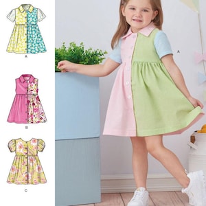 May include: A young girl wearing a color-blocked dress with pink, green, and blue sections. The dress has a button-up front and short sleeves. The image also shows sewing pattern illustrations of similar dresses. The text reads "easy-to-sew".