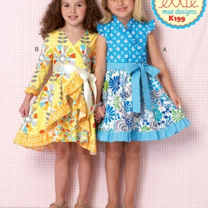 May include: A sewing pattern for two girls' dresses. The dress on the left is a yellow and orange wrap dress with a white sash. The dress on the right is a blue and white floral dress with a blue and white gingham sash. The pattern is called "Ellie" and is by "mae designs".