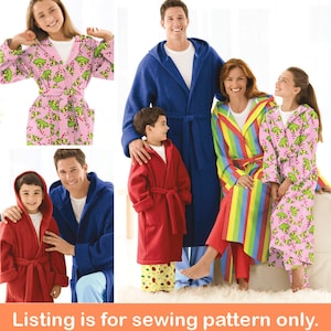 May include: Sewing pattern for a hooded robe. The pattern includes five different designs: a pink robe with a green and white pattern, a blue robe, a red robe, a rainbow striped robe, and a pink robe with a green and white pattern.  The pattern is for a family of five.