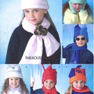 Puede incluir: Imagen de un patrón de costura con gorros y bufandas de invierno para niños. Los gorros son de varios colores, con elementos decorativos. La palabra "FABULOUS" es visible. También está presente el texto "Listing is for sewing pattern only".