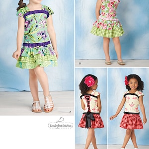 Peut inclure: Patron de couture pour une robe de fille avec trois styles différents. Le premier style est une robe à imprimé floral vert et violet avec une jupe à volants. Le deuxième style est une robe à imprimé floral rose et vert avec une jupe à volants. Le troisième style est une jupe à carreaux rouge et blanc avec un haut à imprimé flamant rose.
