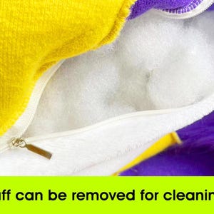 a close up of a purple and yellow towel