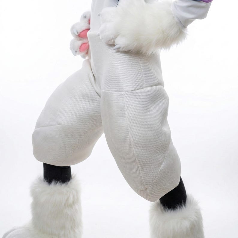 May include: White bunny costume with fluffy paws and leg warmers. The costume features a white jumpsuit with padded knees and black socks. The paws have pink accents. A fun and whimsical outfit for cosplay or themed events.