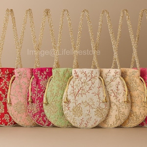 May include: A selection of embroidered drawstring bags in shades of blue, red, pink, and green. Each bag has a gold chain strap and detailed floral patterns. The bags are arranged in a row, highlighting their varied designs and colours.