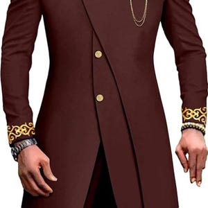 May include: A maroon suit with gold trim and buttons. The jacket has a mandarin collar and a single button closure. The pants have a straight leg.