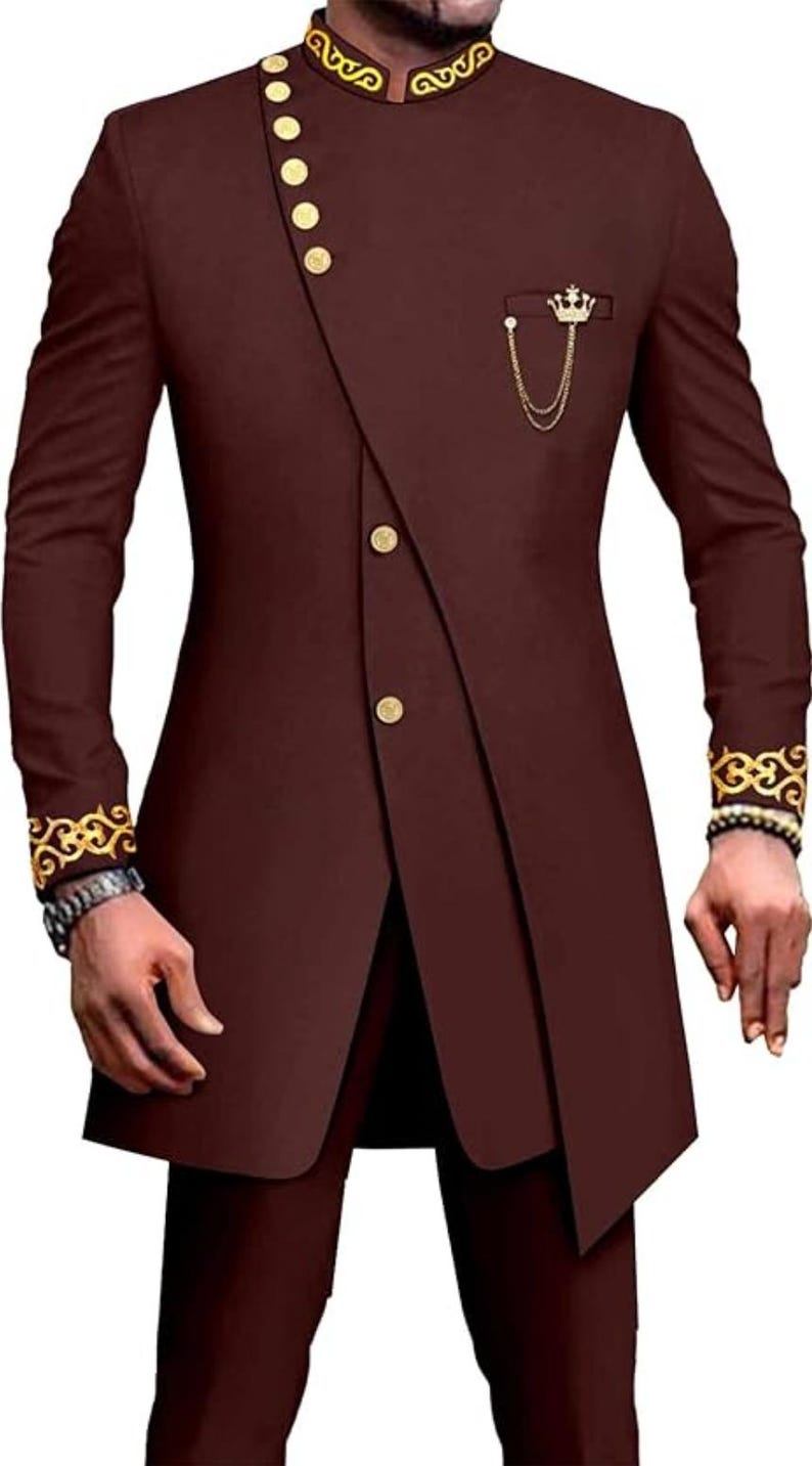 May include: A maroon suit with gold trim and buttons. The jacket has a mandarin collar and a single button closure. The pants have a straight leg.