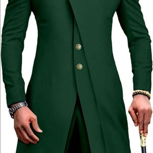 May include: A dark green suit with a mandarin collar and gold buttons. The jacket has a long, asymmetrical hemline and a single button closure. The pants have a straight leg.