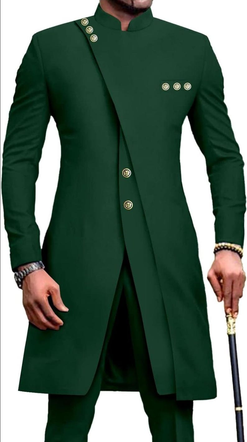 May include: A dark green suit with a mandarin collar and gold buttons. The jacket has a long, asymmetrical hemline and a single button closure. The pants have a straight leg.