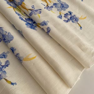 Italian designer linen fabric, high-quality linen fabric with a floral pattern on the edge.