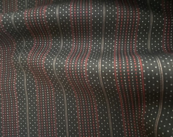 May include: Black fabric with vertical stripes and a subtle polka dot pattern in red and white.