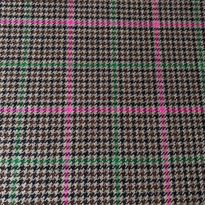 May include: A brown, black, and green plaid fabric with a pink and green checkered pattern.