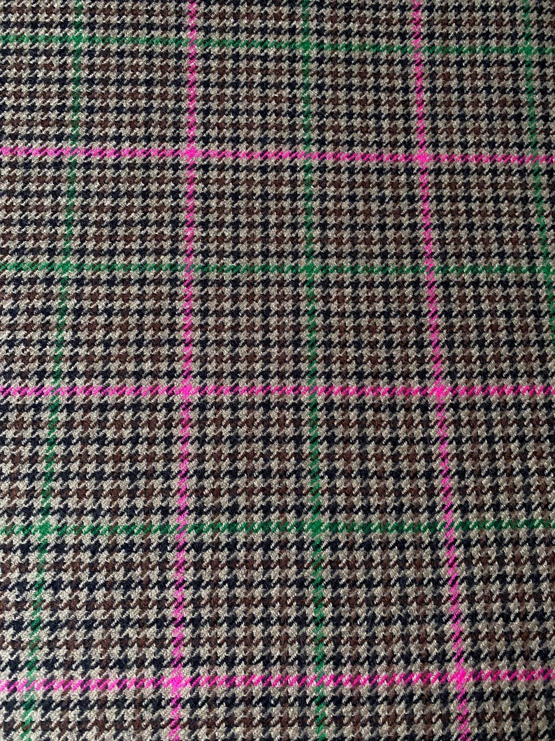 May include: A brown, black, and green plaid fabric with a pink and green checkered pattern.