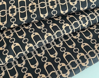 Tessuto jacquard di design italiano, di ottima qualità, misto cotone-poliammide-elastan, nero-marrone. Ultimo pezzo 1,80 metri.