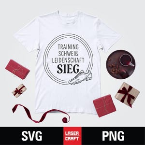 May include: White t-shirt with a black graphic of a soccer cleat and the words "TRAINING, SCHWEIB, LEIDENSCHAFT, SIEG" inside a circle. The image includes wrapped gifts and a drink on a tray.