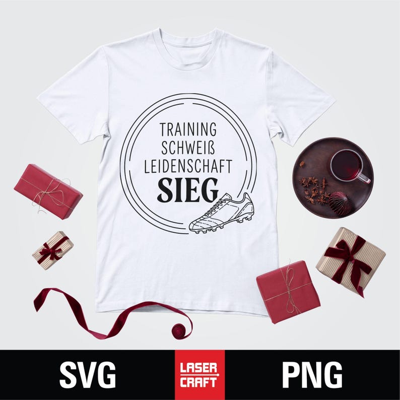 May include: White t-shirt with a black graphic of a soccer cleat and the words "TRAINING, SCHWEIB, LEIDENSCHAFT, SIEG" inside a circle. The image includes wrapped gifts and a drink on a tray.