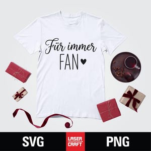 May include: White t-shirt with the text "F&uuml;r immer FAN" in black script and a heart symbol. The shirt is surrounded by wrapped gifts, a tray with a drink, and the words "SVG" and "PNG" at the bottom.