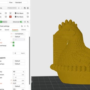 May include: A 3D-printed golden hen figurine, likely a decorative item or part of a larger project. The image shows the hen's side profile, with detailed textures and a textured base. The hen is displayed in a 3D modeling software interface.