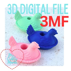 May include: Three 3D-printed hen-shaped objects in pastel colours: pink, blue, and green. Each hen has a hole in the centre. The text "3D DIGITAL FILE" and "3MF" are in the background. The image is on a white surface.