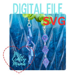 May include: A pair of dangle earrings with a geometric design. The earrings are made of blue glitter resin and have a silver hook. The earrings are shown against a blue background.